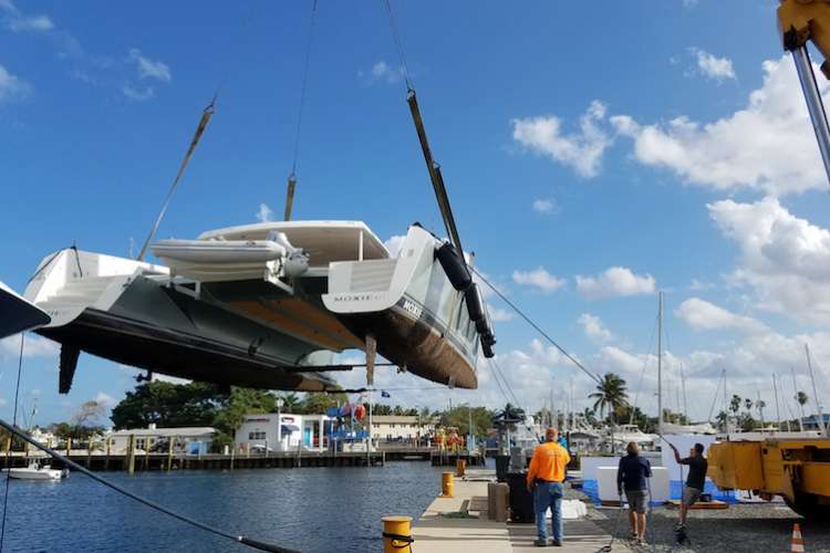 Tender being lifted in a shipyard dock