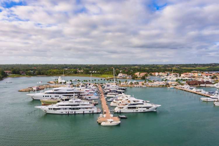 Image of superyachts berthing in the marina