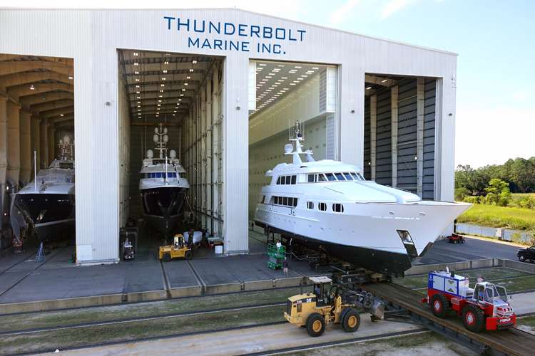 Thunderbolt Marine shipyard hangar with three  superyachts